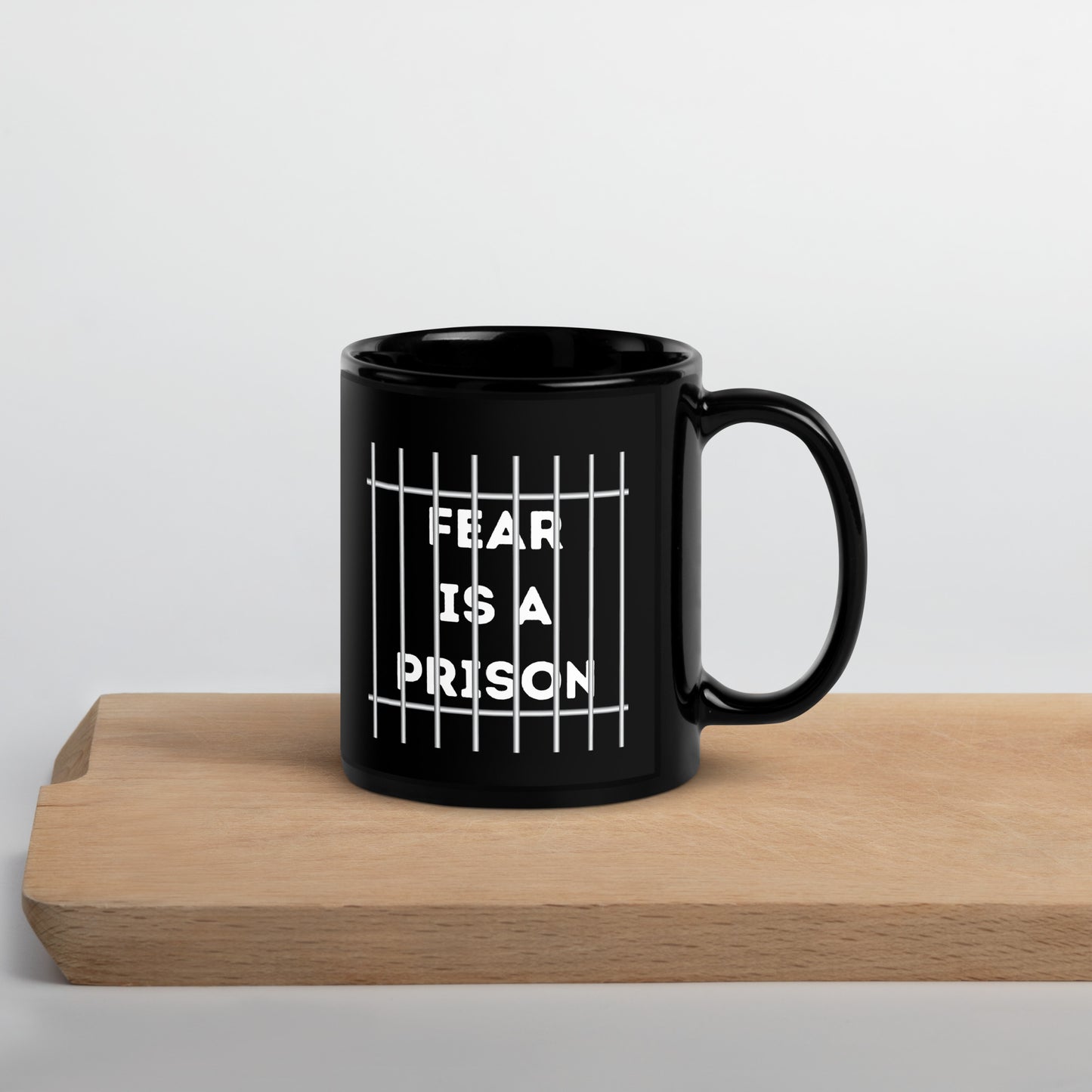FEAR IS A PRISON Black Glossy Mug