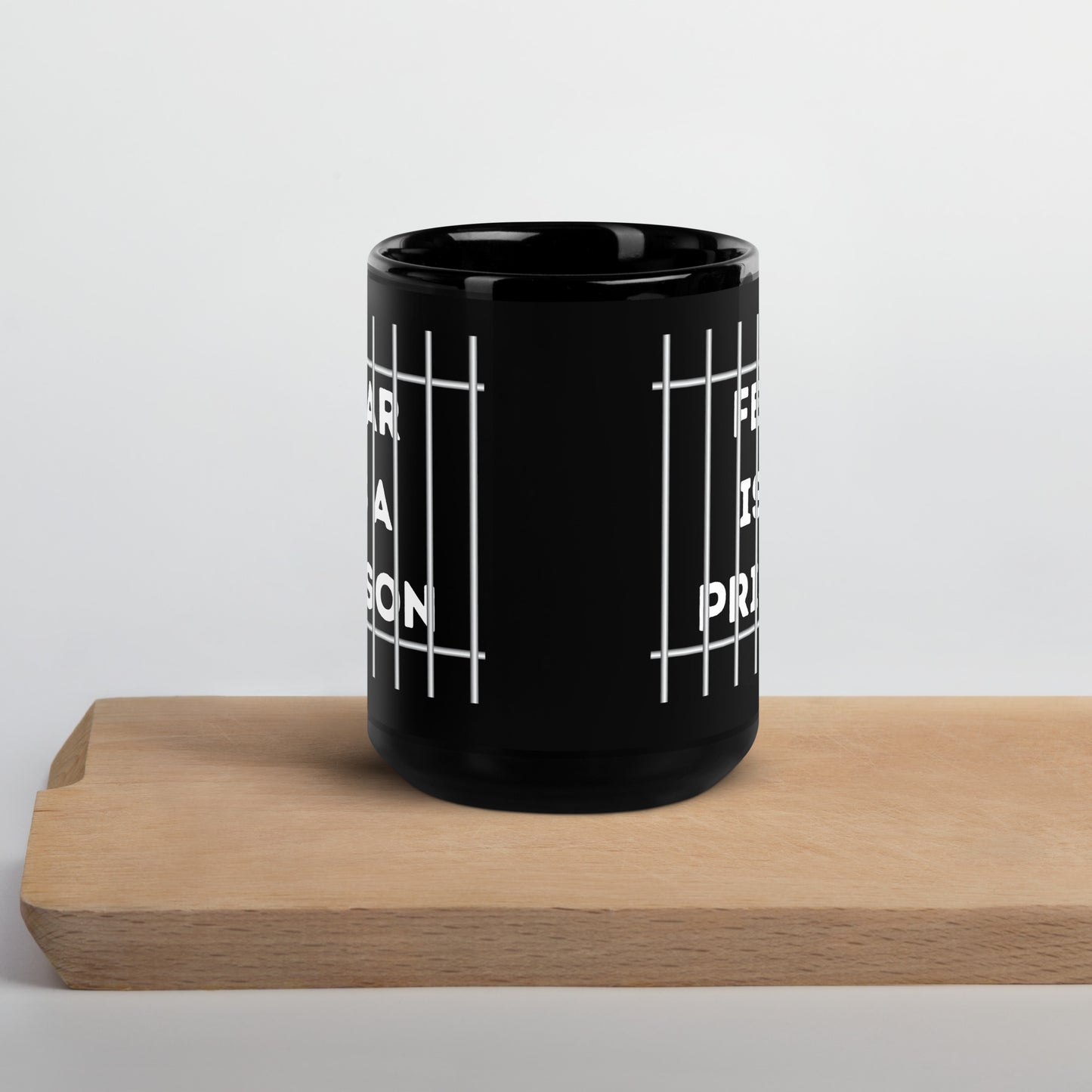FEAR IS A PRISON Black Glossy Mug