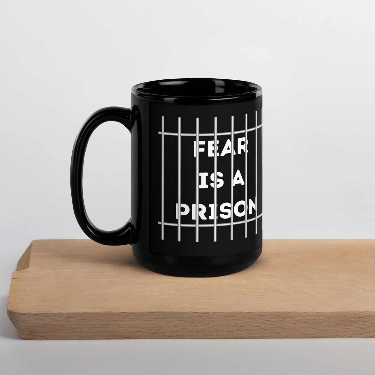 FEAR IS A PRISON Black Glossy Mug