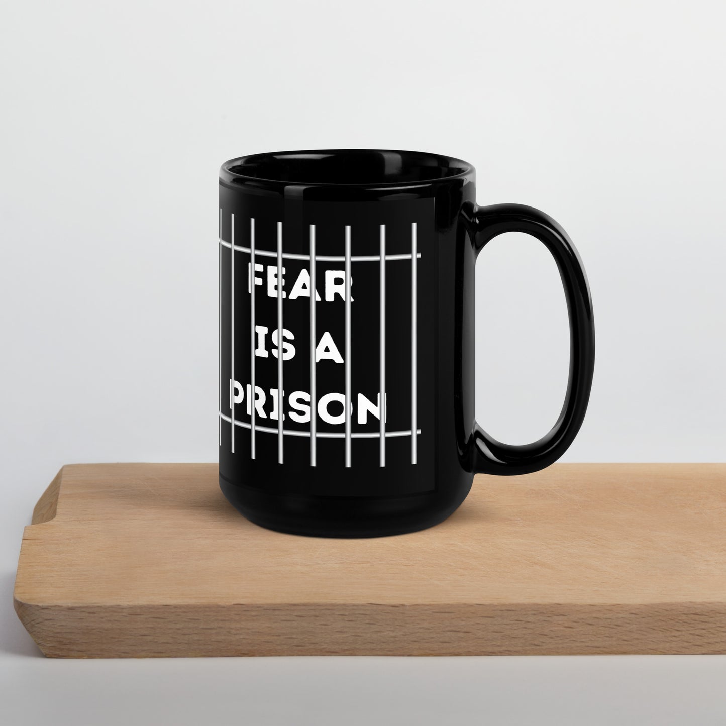 FEAR IS A PRISON Black Glossy Mug